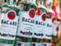 Bottles of Bacardi rum put up for sale in a supermarket, POZNAN, POL - JUN 17, 2021: Bottles of Bacardi rum put up for s