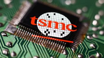 Microchip Photo Illustrations Microchip and TSMC logo displayed on a phone screen are seen in this multiple exposure ill