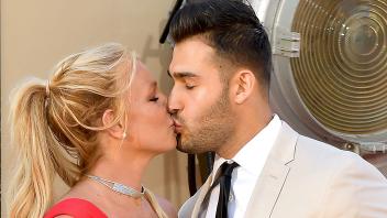 (FILES) US singer Britney Spears (L) and boyfriend Sam Asghari arrive for the premiere of Sony Pictures&apos; "Once Upon a Time... in Hollywood" at the TCL Chinese Theatre in Hollywood, California on July 22, 2019. Spears and her model husband Asghari are heading for a divorce after 14 months of marriage, US media reported -- the latest personal crisis for the troubled pop star. Asghari, 29, filed divorce papers noting "irreconcilable differences" in their relationship, US entertainment media said on August 16, 2023, citing "multiple sources." The couple was married in 2022. (Photo by Matt Winkelmeyer / GETTY IMAGES NORTH AMERICA / AFP)