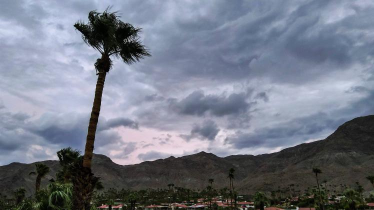 Syndication: Desert Sun Storm clouds clear the mountains ahead of the anticipated arrival of Hurricane Hilary in Rancho 