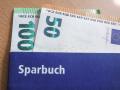 Sparbuch mit Geldscheinen *** Savings book with banknotes Copyright: xLobeca/RalfxHomburgx