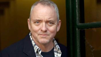 US writer Dennis Lehane poses for photographers before a press conference in Barcelona northeastern