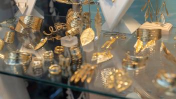 Mykonos, Greece - 10 May 2023: various jewelry in a shop window of a jeweler *** verschiedener Schmuck in einem Schaufen