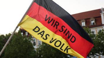 Deutschlandfahne mit Parole Wir sind das Volk *** German flag with slogan \We are the people 1089905896