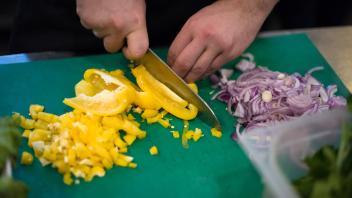 Chef hands cutting fresh and delicious vegetables for cooking or salad. Chef hands cutting fresh and delicious vegetable