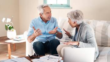 Money can make a real mess of marriage. a senior couple having a disagreement while going through paperwork at home. Mon