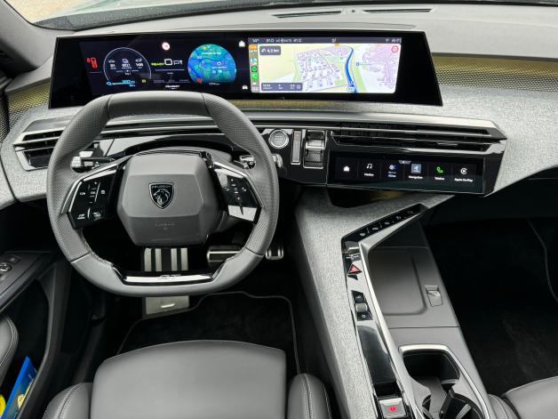 Digitally controlled cockpit with small standard steering wheel. 