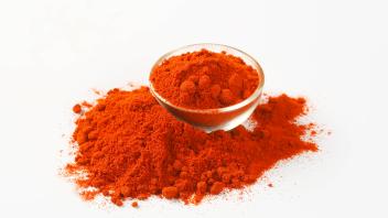 RECORD DATE NOT STATED Heap of ground red pepper in glass bowl and next to it , 26019196.jpg, paprika, spice, powder, re