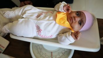 December 26, 2023, SANAA, Sanaa, Yemen: A child is being weighed at a malnutrition treatment ward of a hospital in Sana