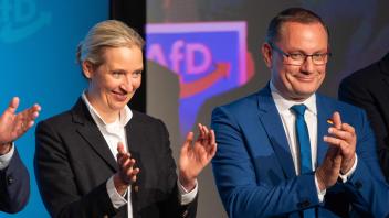 Alice Weidel (L), co-leader of the far-right Alternative for Germany (AfD) party and co-leader of the far-right Alternative for Germany (AfD) party Tino Chrupalla applaud during the party&apos;s meeting in preparation of the June 2024 European Elections, on April 27, 2024 in Donaueschingen, southern Germany. Maximilian Krah, who is the AfD&apos;s top candidate for June&apos;s EU elections, will not speak at the meeting, as he is at the centre of a deepening crisis after one of his aides in the European Parliament was arrested on suspicion of spying for China. German prosecutors have also launched a preliminary investigation against Krah himself over reports of suspicious payments received from China and Russia. (Photo by SILAS STEIN / AFP)