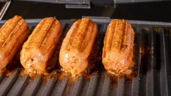 Plant-based vegetarian Sausages being grilled on griddle , 30112206.jpg, beyond meat, brand, beyond, grill, plant based 