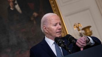 US President Joe Biden checks his watch as he arrives to speak about the situation in the Middle East, in the State Dining Room of the White House on May 31, 2024. Biden announced that Israel has offered a "roadmap" to a full ceasefire in the Middle East ally&apos;s military campaign against Hamas in Gaza, including a troop withdrawal and release of hostages. Biden also commented that it is &apos;dangerous&apos; for Donald Trump to claim that Trump&apos;s recent guitly verdict was rigged. (Photo by Brendan Smialowski / AFP)
