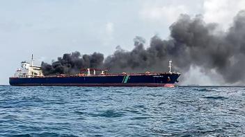 A handout photo taken and released by Malaysian Maritime Enforcement Agency on July 19, 2024 shows the Singapore-flagged tanker Hafnia Nile on fire in Tanjung Sedili, near Singapore. Singaporean authorities said two oil tankers caught fire off its coast and two crew members were airlifted to a hospital. (Photo by Handout / Malaysian Maritime Enforcement A / AFP) / RESTRICTED TO EDITORIAL USE - MANDATORY CREDIT AFP PHOTO / Malaysian Maritime Enforcement Agency - NO MARKETING - NO ADVERTISING CAMPAIGNS - DISTRIBUTED AS A SERVICE TO CLIENTS